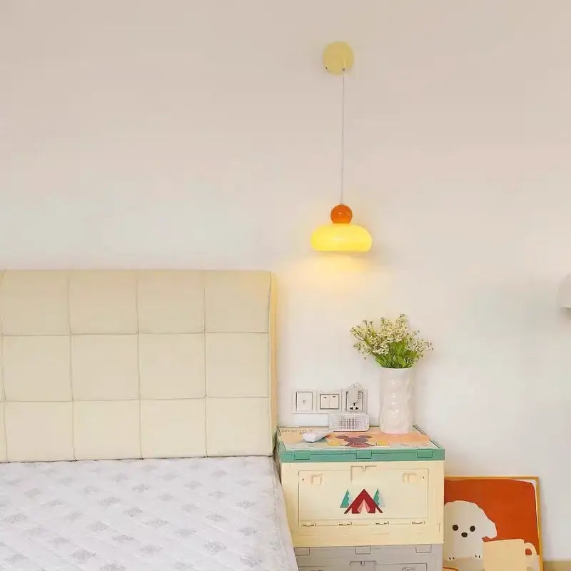 A cheerful yellow and orange dome-shaped pendant lamp with slender cord fitting decorbites iron nordic led wall light design