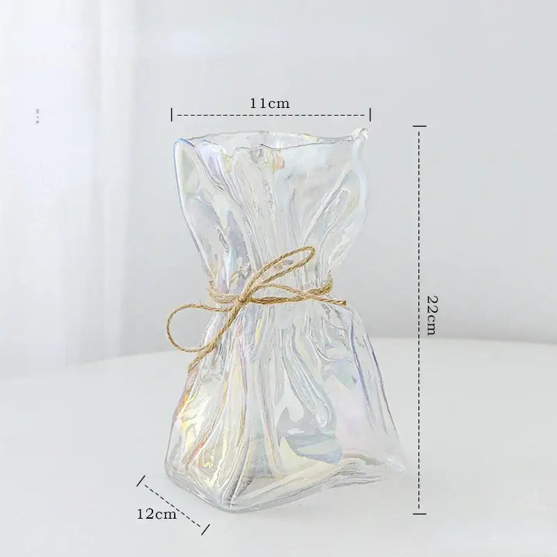 Irregular folded clear glass vase shaped like a tied gift bag with rustic twine bow by decorbites clear glass decor