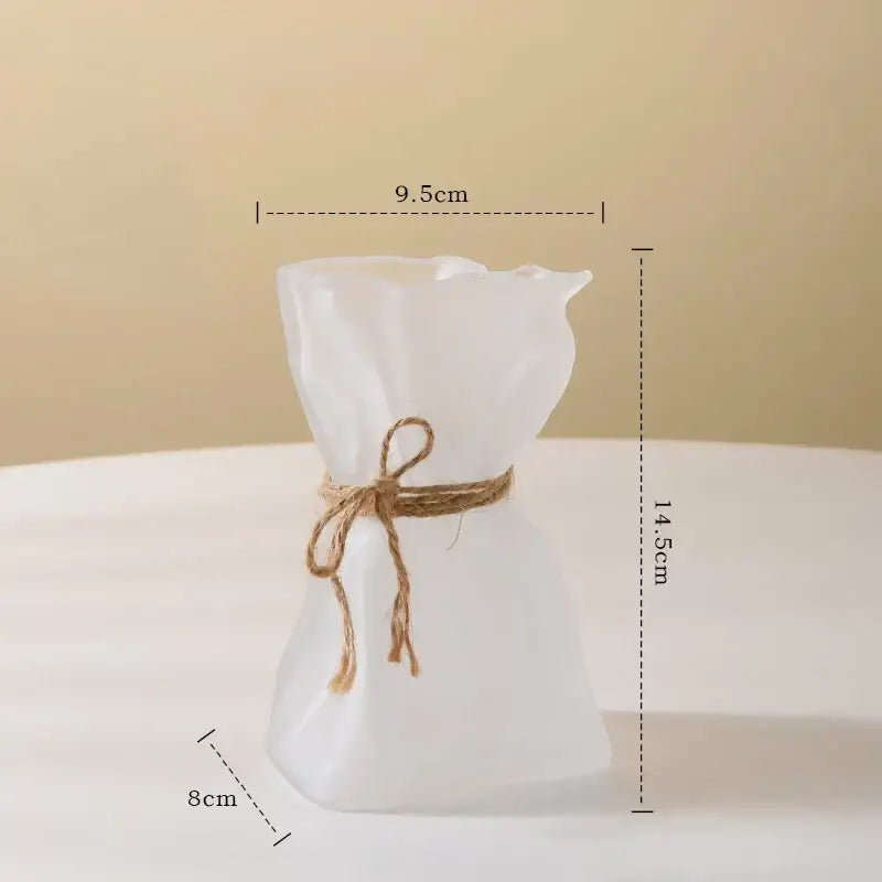 A decorbites clear glass vase shaped like a tied fabric sack with frosted white glass and rustic twine bow decorbites clear glass