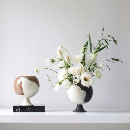 Two ceramic irregular grain spherical vases in black white and muted brown decorbites irregular grain living room decor