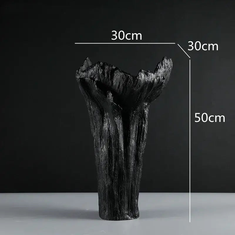 Black irregular resin vase with white textured tree trunk ridges and flared top by decorbites for living room decor