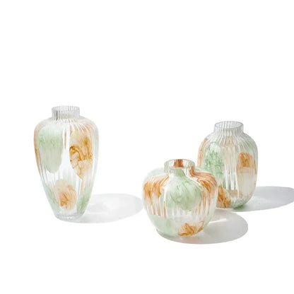 Three translucent irregular ribbed green and brown clear glass vases with abstract swirls for living room decorbites decor