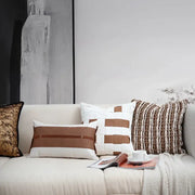 A beige sofa with decorbites italian light luxury brown and white cushion cover featuring woven patterns and living room decor