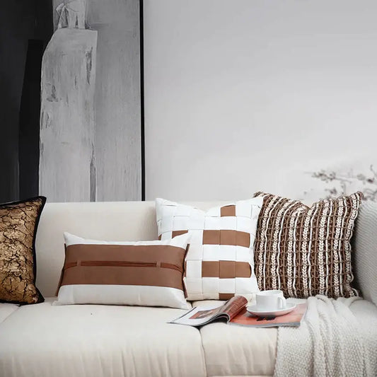 A beige sofa with decorbites italian light luxury brown and white cushion cover featuring woven patterns and living room decor