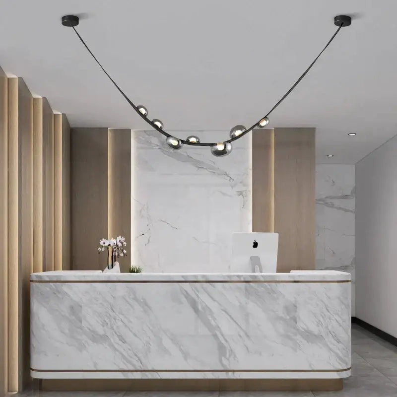Modern white marble reception desk with gold trim and minimalist design for decorbites italian light luxury interiors