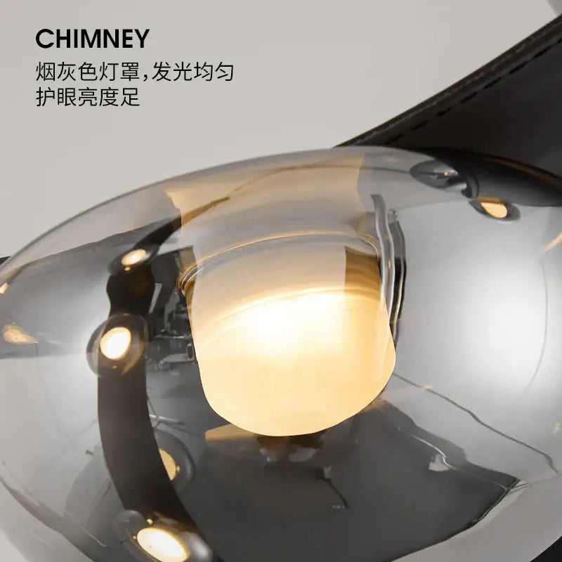 Italian light luxury black metal chandelier with smoke-gray glass lampshade and warm lighting for dining room decorbites italian light
