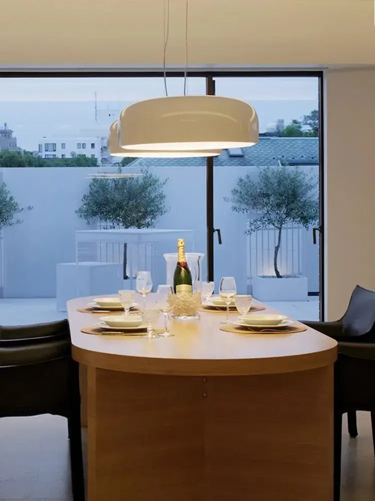 Cream-colored modern pendant ceiling lamp with sleek rounded design by decorbites italian minimalist round for dining room