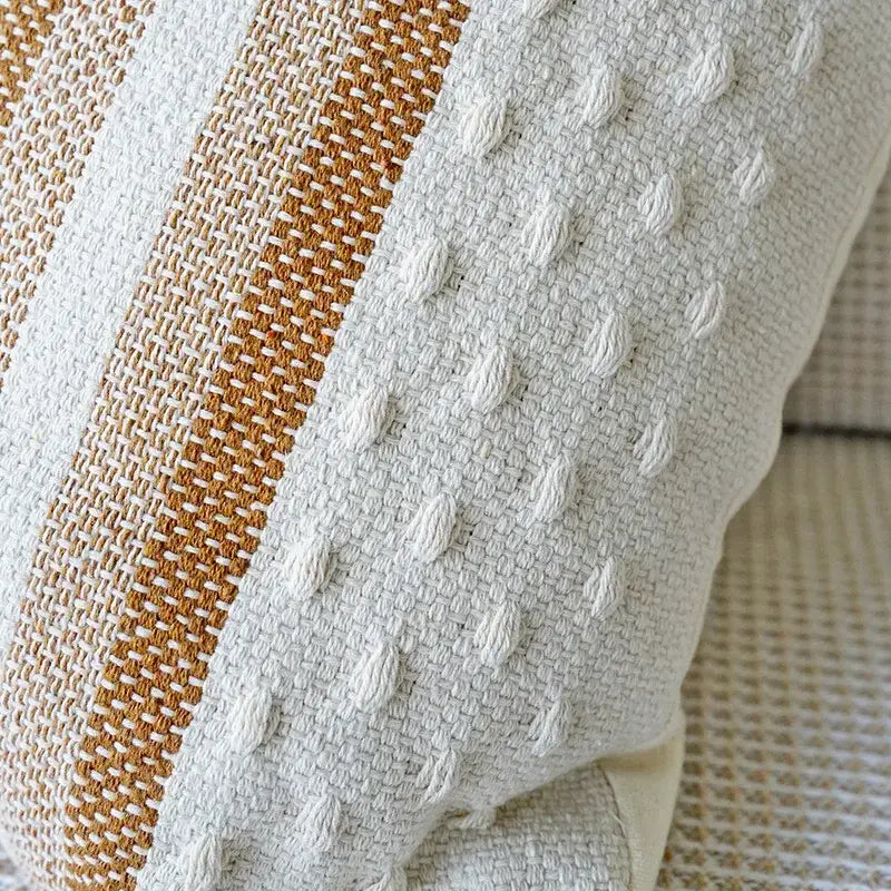 Cream-colored pillow case with textured weave and vertical tan stripe for decorbites ivory brown coffee living room decor