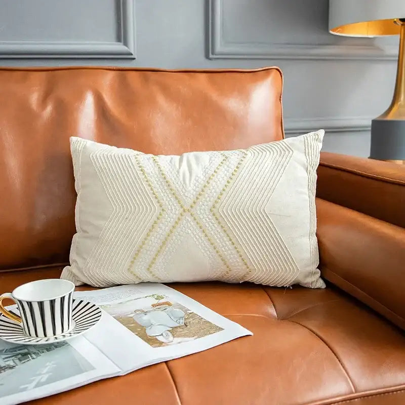 Cream-colored cushion cover with intricate gold-threaded geometric embroidery for decorbites ivory geometric decor