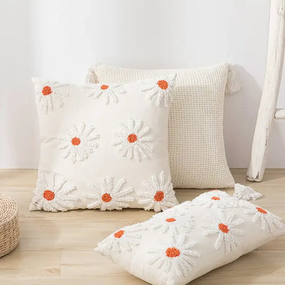 Ivory tufted cushion cover with cream color and white daisy embroidery featuring orange centers for living room decorbites cushion cover