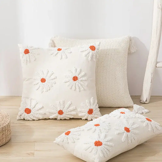 Ivory tufted cushion cover with cream color and white daisy embroidery featuring orange centers for living room decorbites cushion cover