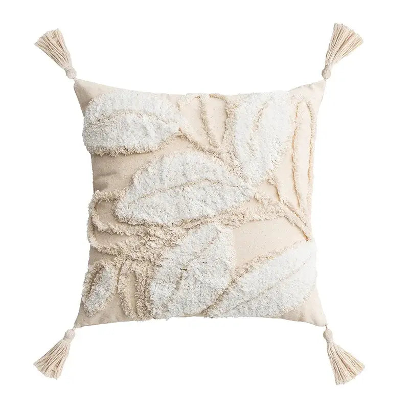 Beige throw pillow with ivory tufted cushion cover featuring layered leaf embroidery and tassels for elegant decorbites decor