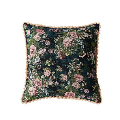 Dark green velvet pillow case with intricate pink and white floral embroidery and beige fringe for jacquard farmhouse decor