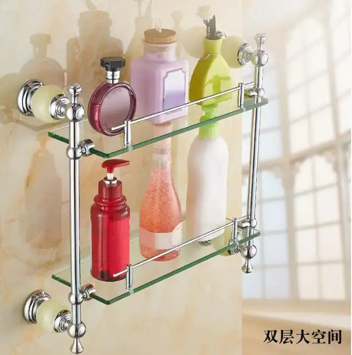 Chrome-finished double-tiered glass bathroom shelf with ornate metal brackets and knobs from jade bathroom set decorbites brass