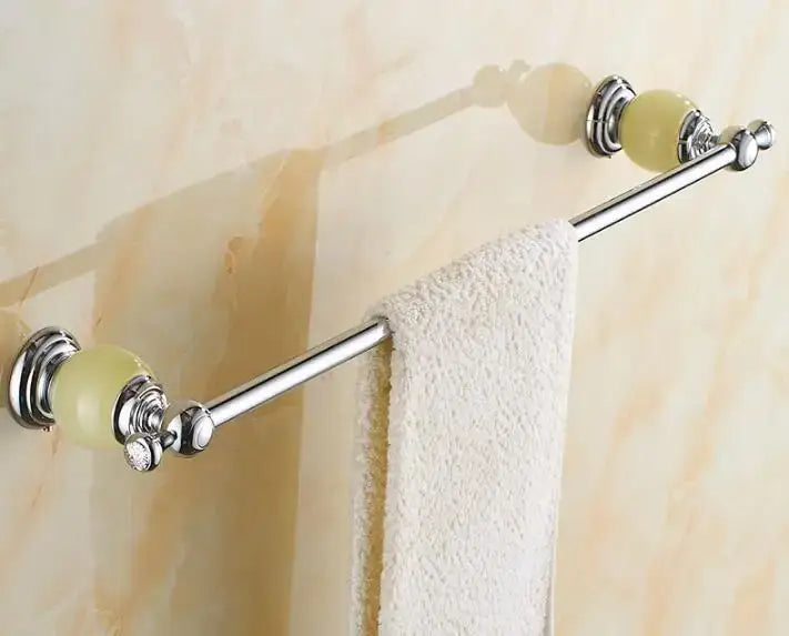 Chrome-finished double towel rack with pale green jade-like finials and white towel in jade bathroom set decorbites brass