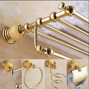 Gold-toned bathroom towel rack with ornate spherical finials and amber marble end in jade gold bathroom accessories set