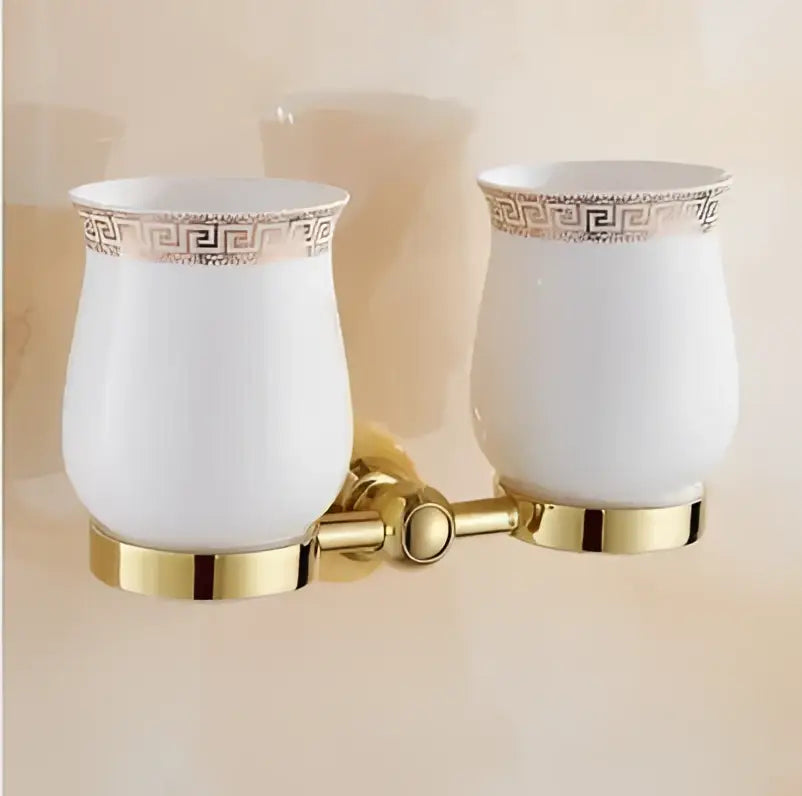 White ceramic toothbrush holders with gold greek key trim and bases from jade gold bathroom accessories set
