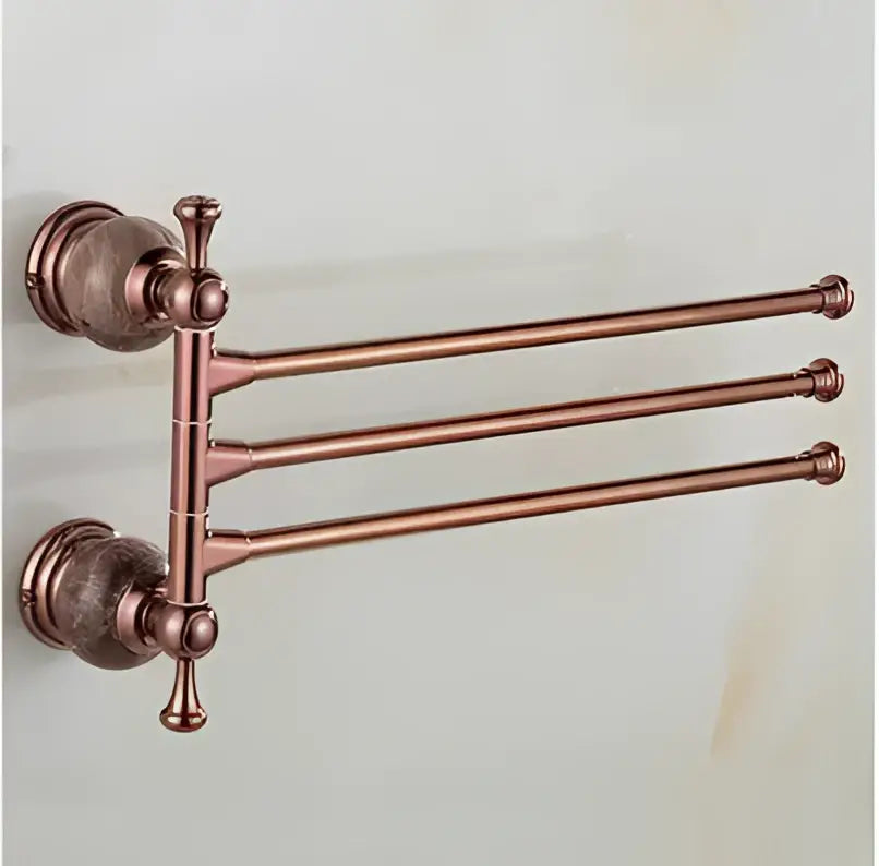 Antique copper-finished three-bar towel rack with ornate vintage-inspired hardware in jade rose gold bathroom set