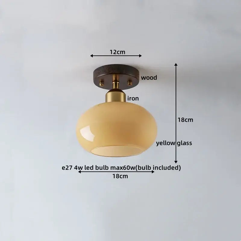 Japanese amber glass led ceiling lamp with warm yellow globe and dark wood brass mounting base for living room decorbites led ceiling