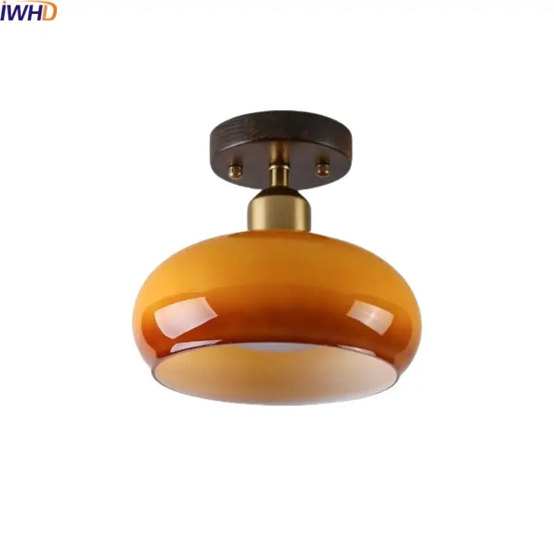 Warm amber glass led ceiling lamp with brass stem and dark wood mount for living room decorbites ceiling lamp