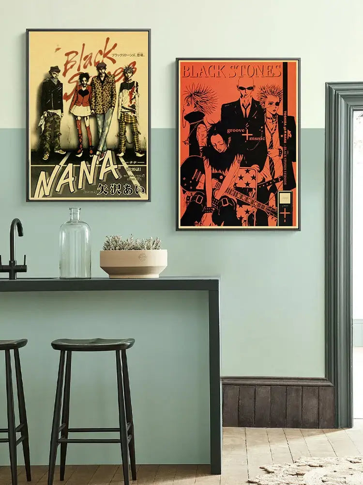 Two framed DecorBites Japanese anime nana posters with bold orange black stones and vintage beige nana characters artwork