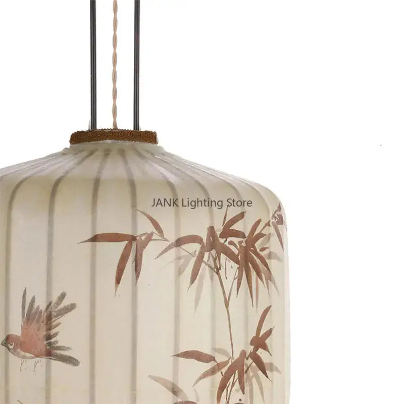 Cream-colored paper lantern with bamboo leaf pattern and bird illustrations for living room pendant light