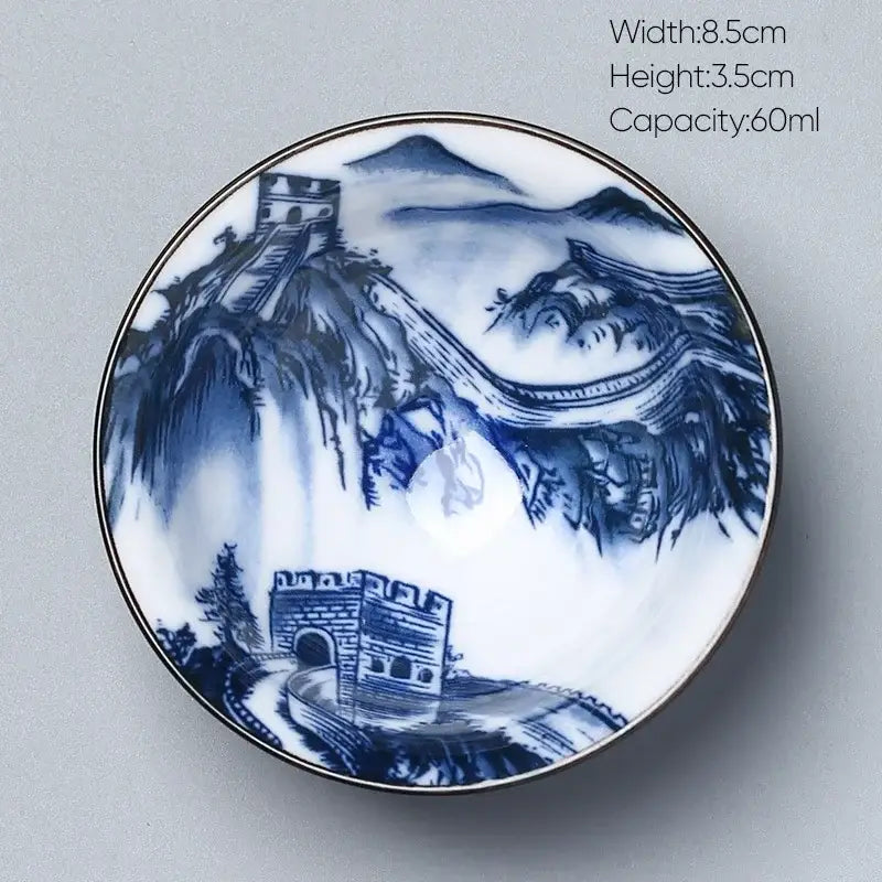 A delicate white porcelain japanese blue and white kung fu tea cup with hand-painted great wall design and gold rim by decorbites ceramic kung
