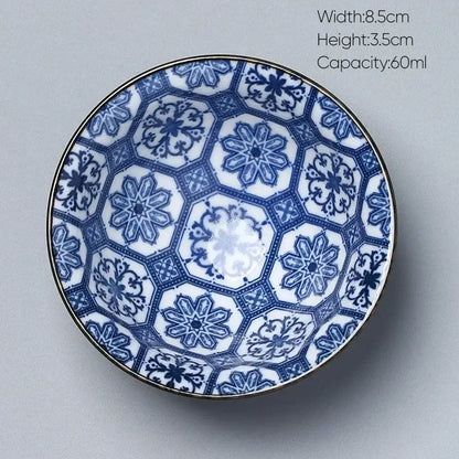 Blue and white ceramic kung fu tea cup porcelain bowl with intricate hexagonal floral patterns and a gold rim decorbites ceramic