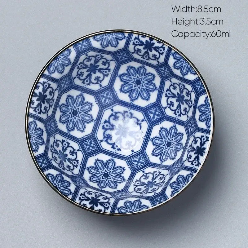 Blue and white ceramic kung fu tea cup porcelain bowl with intricate hexagonal floral patterns and a gold rim decorbites ceramic