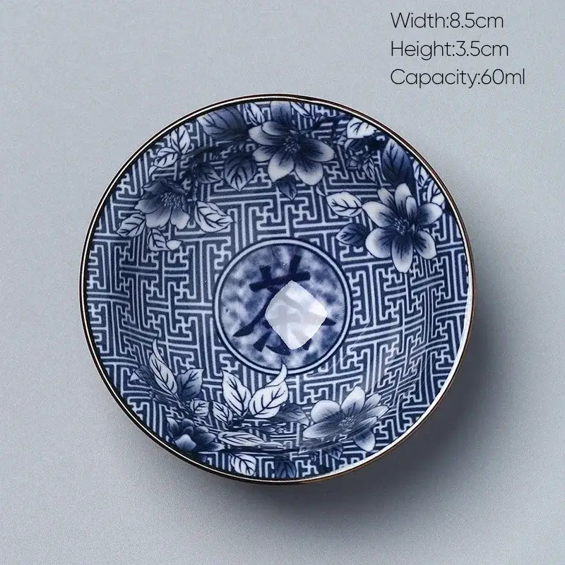 Japanese blue and white porcelain kung fu tea cup with intricate floral patterns and gold-trimmed edge by decorbites ceramic kung