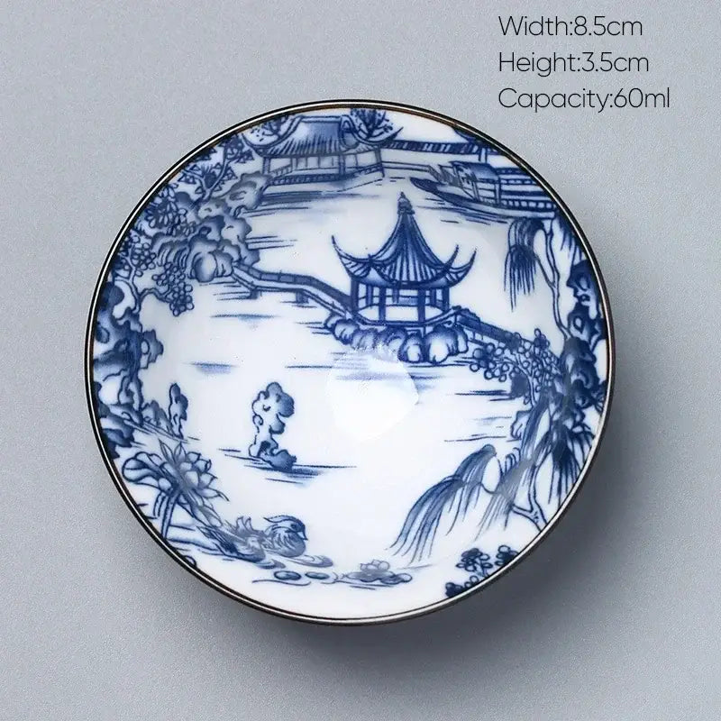 A delicate white porcelain saucer with blue hand-painted chinese garden scene for decorbites ceramic kung fu tea use