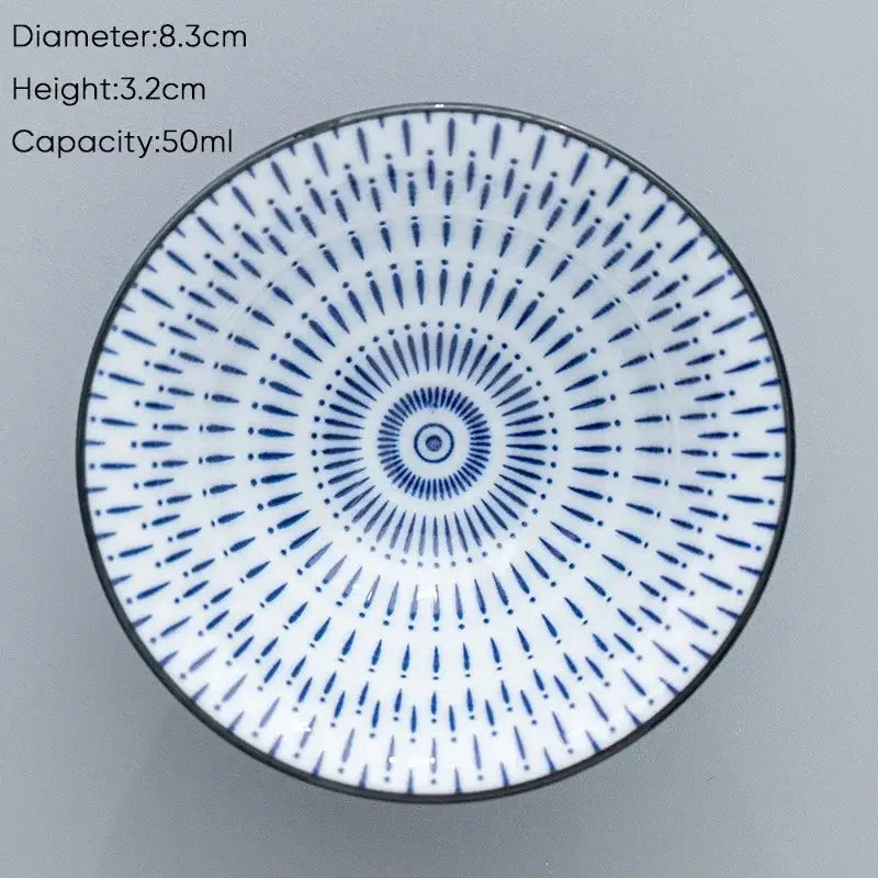 A white ceramic kung fu tea cup with blue radial pattern and black rim 8.3cm diameter 50ml capacity for dining room use