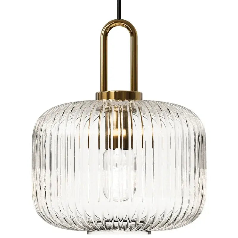 Clear ribbed glass pendant light with brass-finished metal fixture helps create elegant kitchen glass stone accents