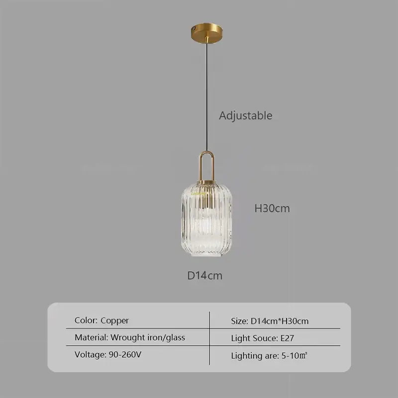 Copper-finished pendant light with a ribbed clear glass shade and wrought iron hardware helps create warm ambiance