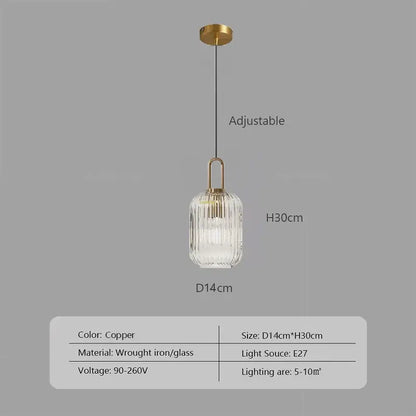 Copper-finished pendant light with a ribbed clear glass shade and wrought iron hardware helps create warm ambiance