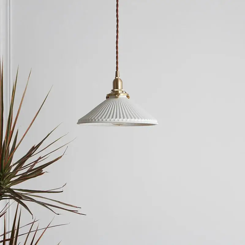 Japanese cream ribbed ceramic led pendant light with fluted design and brass accents on twisted brown cord for dining room decorbites ceramic led pendant