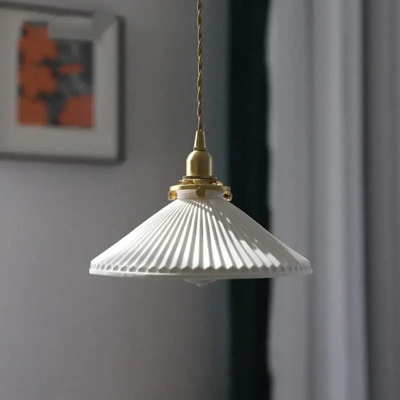 Japanese cream ribbed ceramic led pendant light with brass fixture and twisted cord for dining room decorbites ceramic led