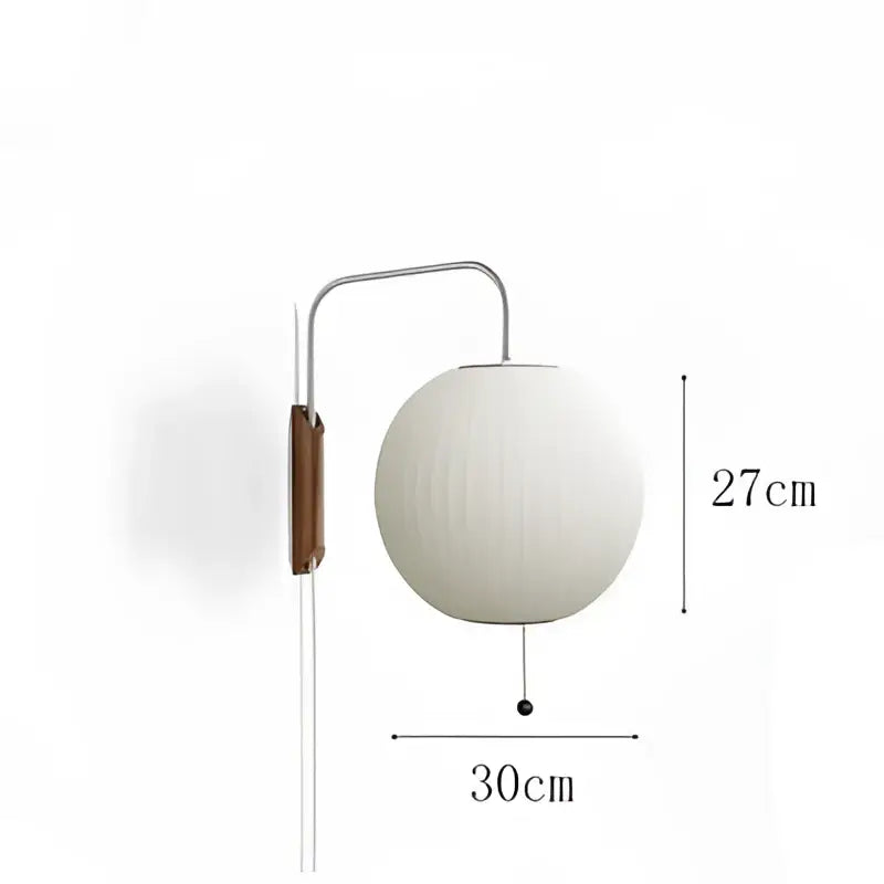 Minimalist white spherical wall light with sleek metallic arm and wooden accent plate decorbites handwoven silk ball
