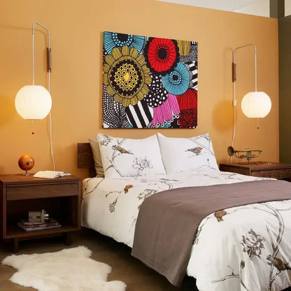 Vibrant abstract floral canvas art with bold red blue yellow and black patterns above a decorbites handwoven silk ball wall light