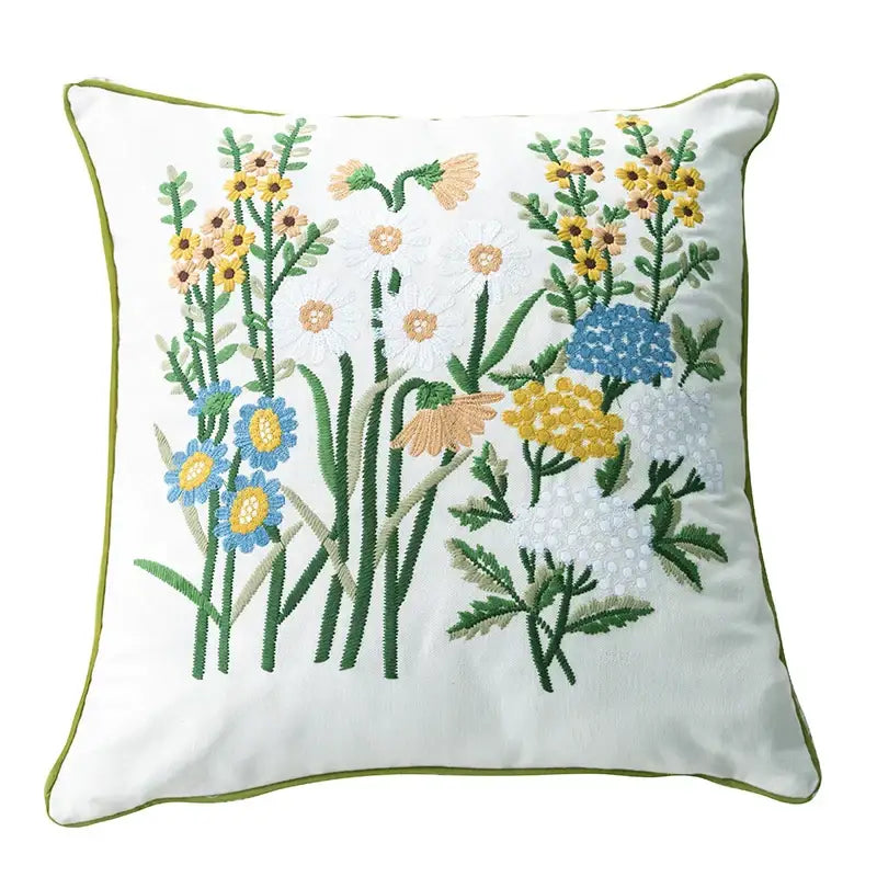White cushion with intricate yellow blue and green floral embroidery linen embroidery japanese decorbites cotton linen pillowcase