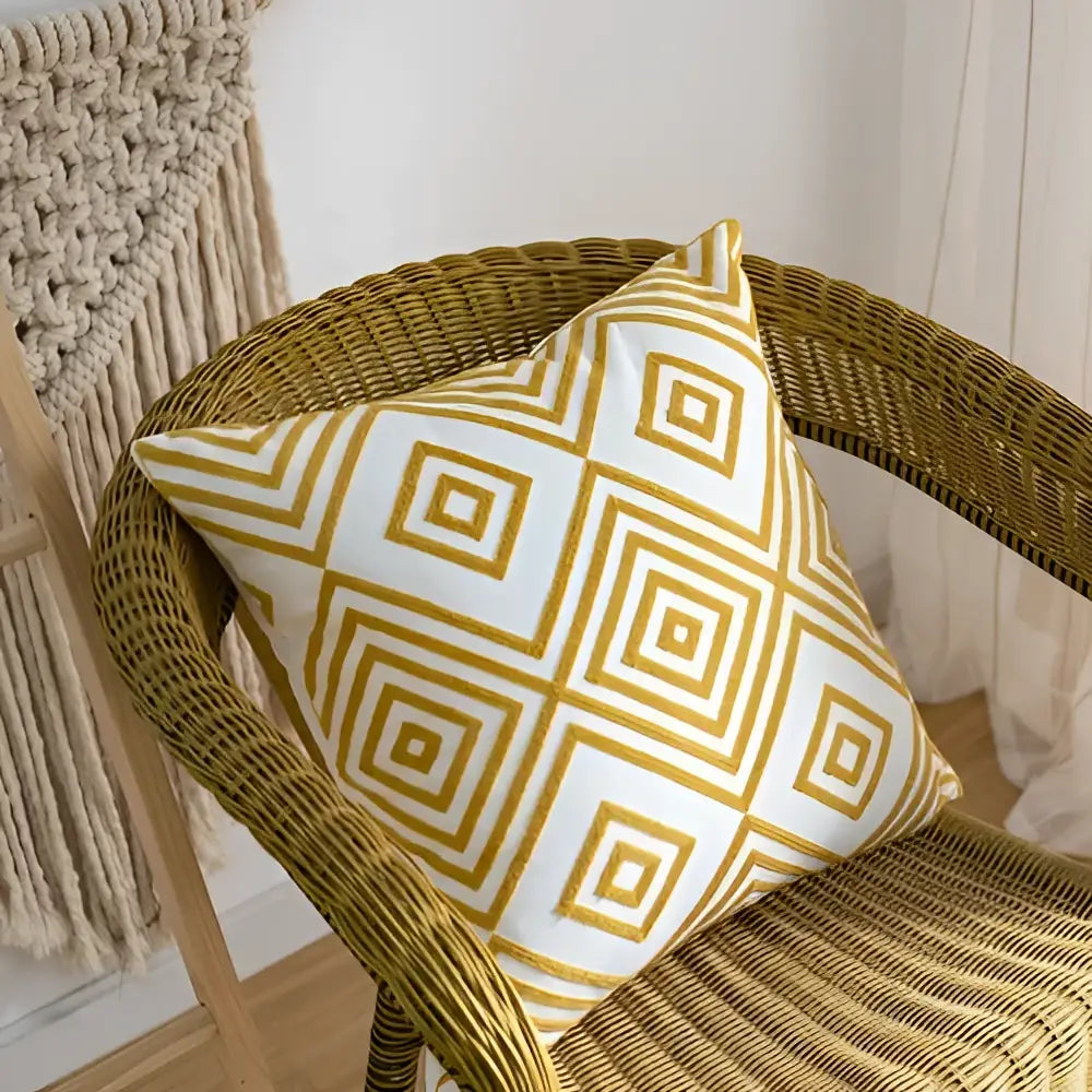 White throw pillow with gold geometric pattern and woven texture made from decorbites cotton linen embroidery fabric