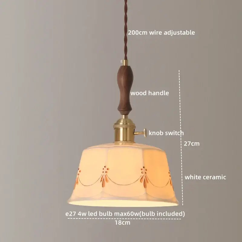 A warm-toned white ceramic led pendant light with brown floral embroidery and brass accent for living room decorbites ceramic led