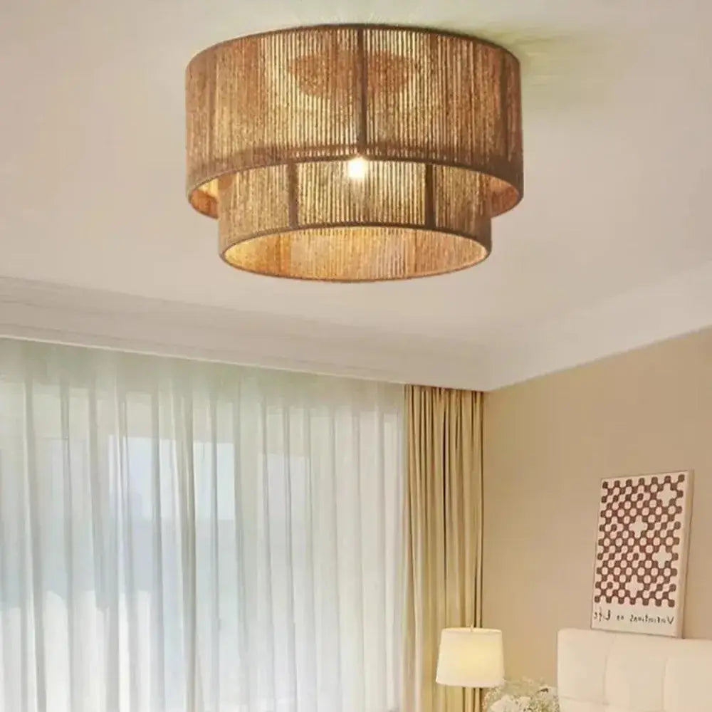Japanese golden two tiered woven pendant light with warm tone and natural materials as a dining room light source