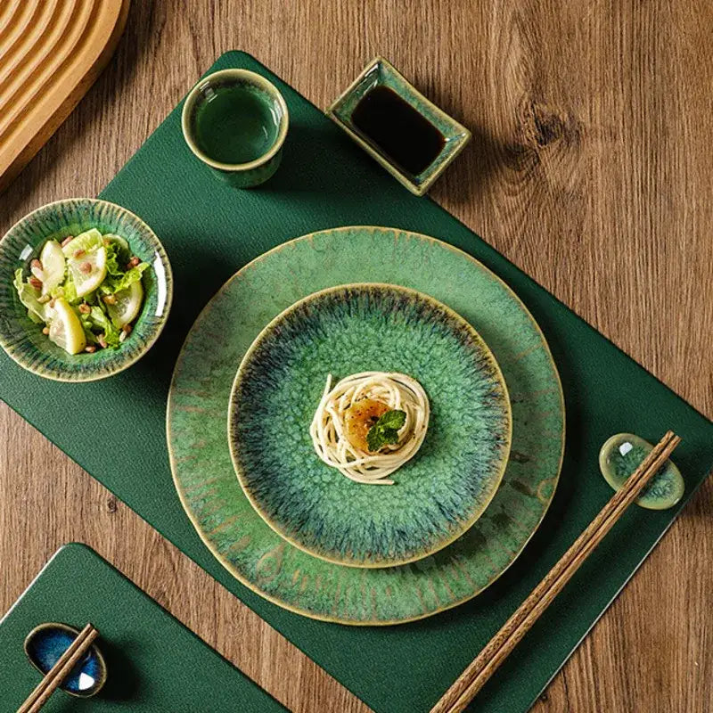 Set of decorbites ceramic dinnerware in green textured glaze with rustic edges ideal for dining room use