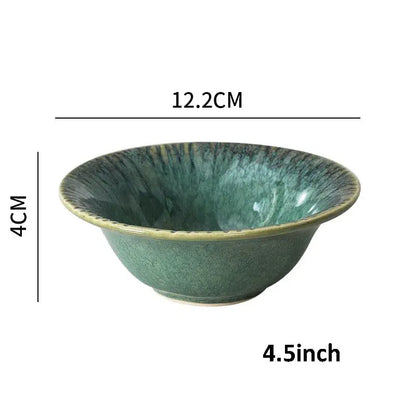 A handcrafted ceramic dinnerware bowl in teal with radial streaks and a raised rim from decorbites ceramic dinnerware set