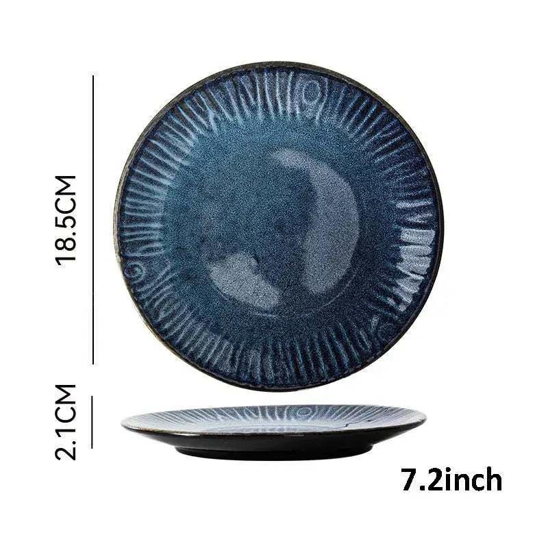 A deep blue textured ceramic dinner plate with a sunburst pattern from decorbites ceramic dinnerware set