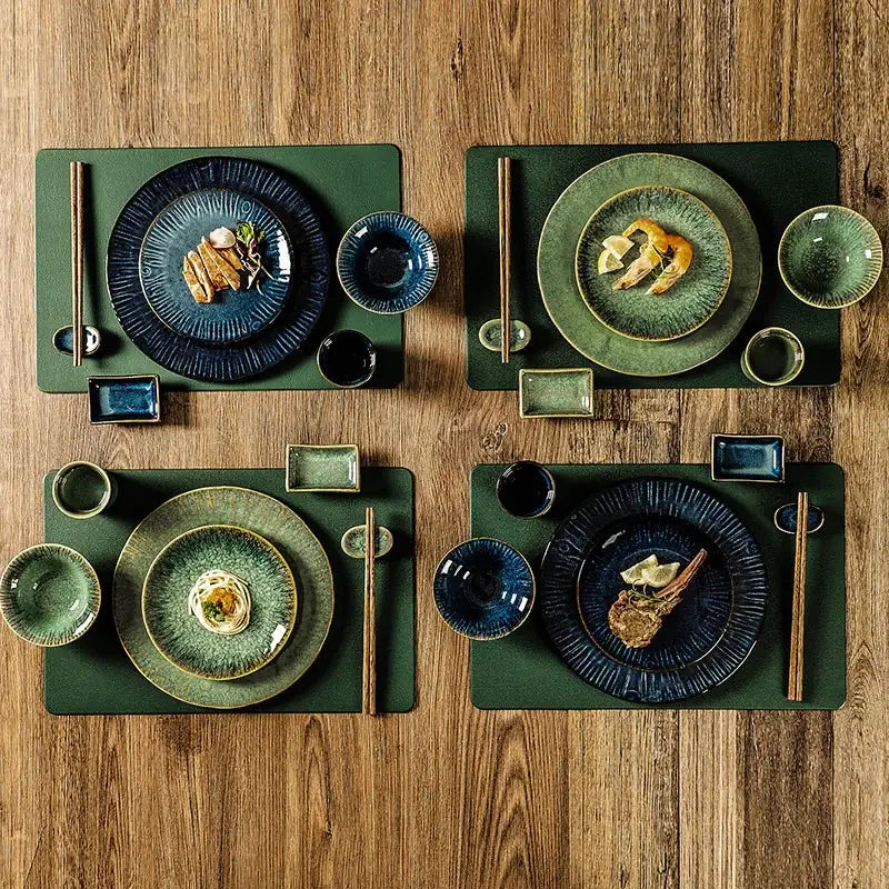 Set of four decorbites ceramic dinnerware sets featuring deep green and navy blue glaze with textured rims for dining use