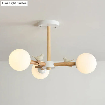 Japanese-Inspired Bedroom Chandelier with Orb Shade, Birds, Wood, and Glass in White