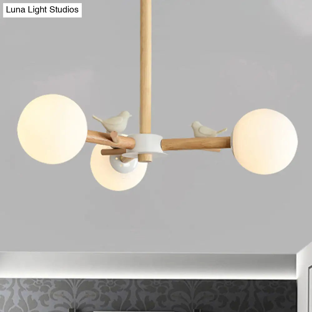 Japanese-Inspired Bedroom Chandelier with Orb Shade, Birds, Wood, and Glass in White
