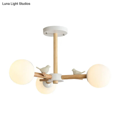 Japanese-Inspired Bedroom Chandelier with Orb Shade, Birds, Wood, and Glass in White